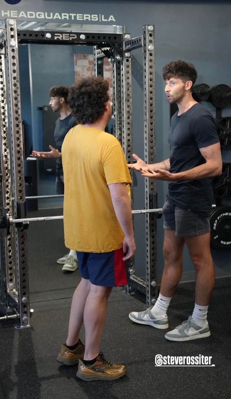 Steve coaching a client between sets at the gym